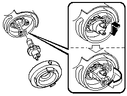 3. Unhook the bulb retaining spring.