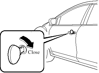 2. Turn the key toward the back and hold